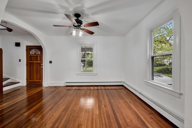 291 E St, New Britain, CT 06051 - empty room featuring a healthy amount of sunlight, baseboard heating, and ceiling fan