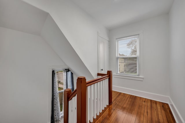 291 E St, New Britain, CT 06051 - hallway with an upstairs landing, baseboards, wood-type flooring, and lofted ceiling