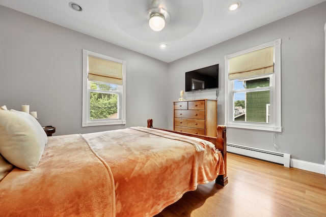 291 E St, New Britain, CT 06051 - bedroom with wood finished floors, a ceiling fan, baseboards, a baseboard heating unit, and recessed lighting