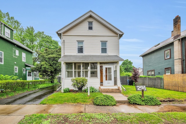 291 E St, New Britain, CT 06051 - view of front facade with a front yard and fence