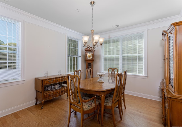 411 Brookside Ct Unit 411, Newtown, CT 06470 - dining space with a chandelier, light wood finished floors, baseboards, and ornamental molding