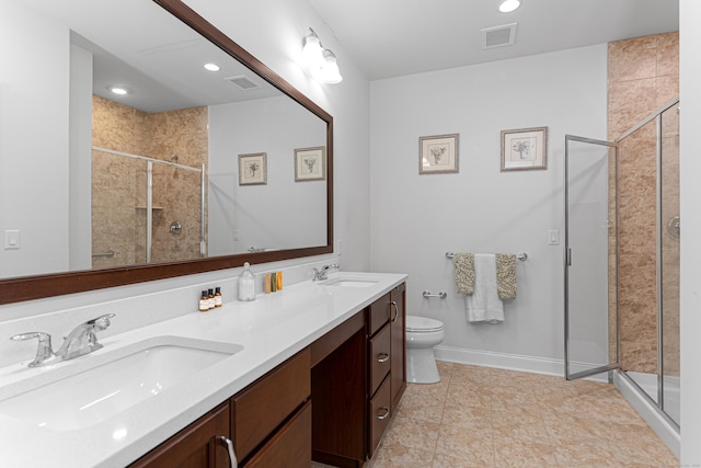 411 Brookside Ct Unit 411, Newtown, CT 06470 - bathroom with a shower stall, toilet, double vanity, baseboards, and recessed lighting