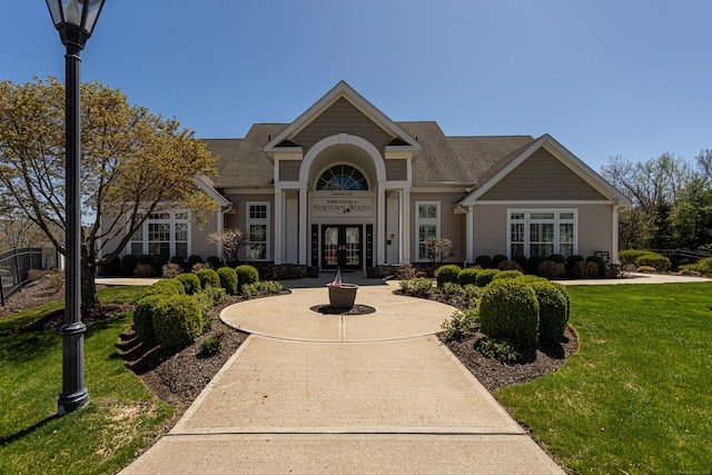 411 Brookside Ct Unit 411, Newtown, CT 06470 - view of front of home with french doors, a front lawn, and a shingled roof