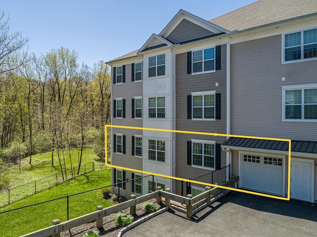 411 Brookside Ct Unit 411, Newtown, CT 06470 - view of front of home with asphalt driveway and a garage