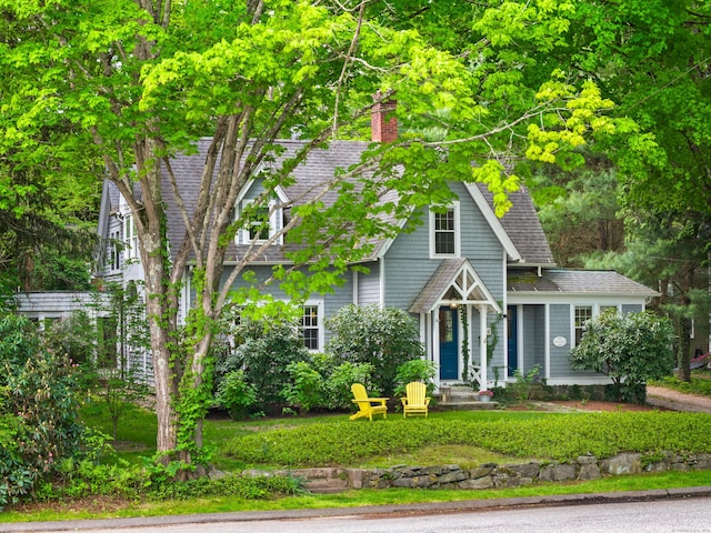 34 W Ave, Essex, CT 06426 - view of front of house with a chimney and roof with shingles