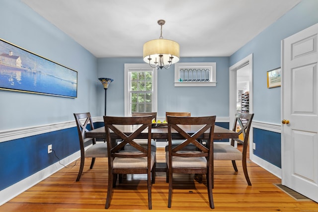 34 W Ave, Essex, CT 06426 - dining area featuring a chandelier and light wood-style floors