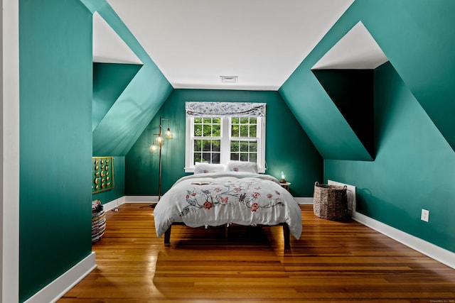 34 W Ave, Essex, CT 06426 - bedroom with wood finished floors and vaulted ceiling