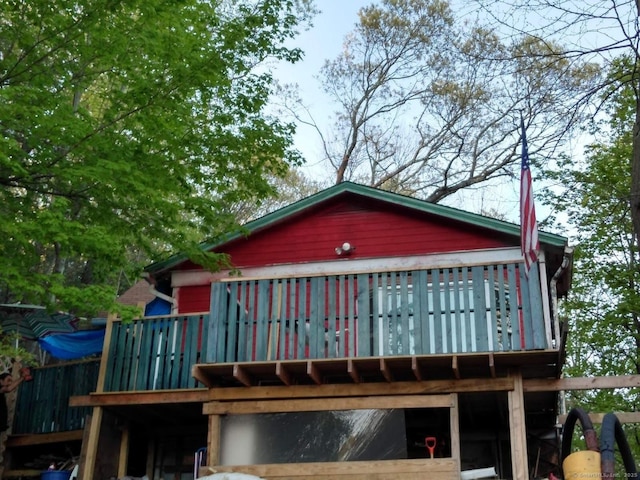 back of property featuring a wooden deck