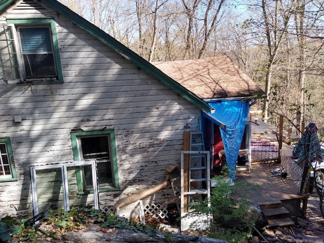 view of side of property with a deck