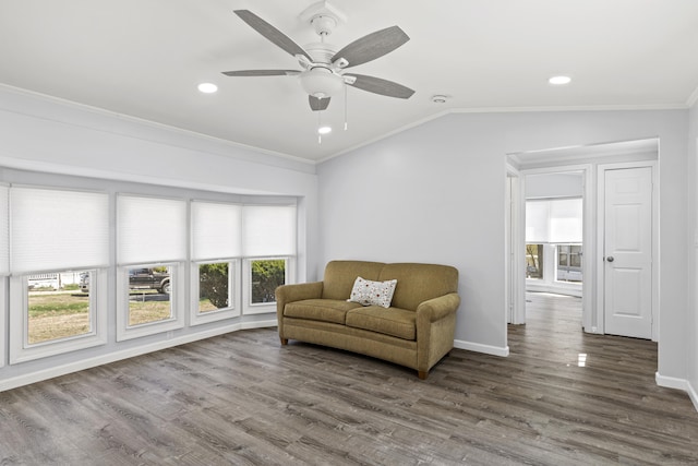 sitting room featuring crown molding, recessed lighting, wood finished floors, and a wealth of natural light