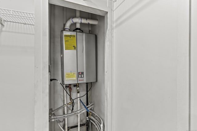 utility room featuring water heater