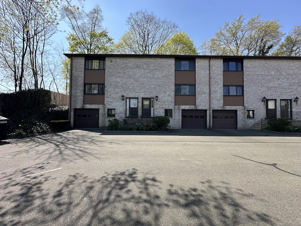 exterior space with an attached garage and driveway