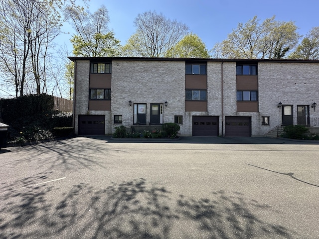 exterior space with an attached garage and driveway