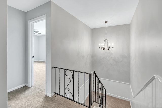 44 Columbus Pl Unit 2, Stamford, CT 06907 - staircase featuring carpet floors, a chandelier, and baseboards