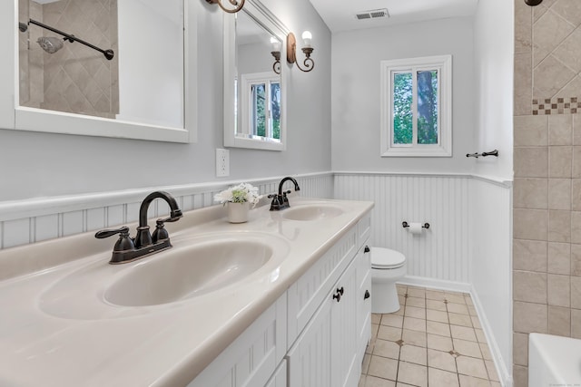44 Columbus Pl Unit 2, Stamford, CT 06907 - full bath with toilet, tile patterned flooring, a shower, a wainscoted wall, and double vanity