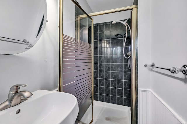 44 Columbus Pl Unit 2, Stamford, CT 06907 - bathroom with a sink, a shower stall, and wainscoting