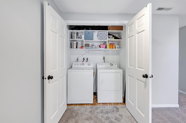 44 Columbus Pl Unit 2, Stamford, CT 06907 - laundry room with washer and dryer, light colored carpet, and baseboards