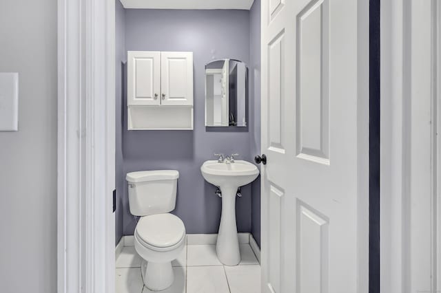 44 Columbus Pl Unit 2, Stamford, CT 06907 - bathroom with toilet, tile patterned flooring, baseboards, and a sink