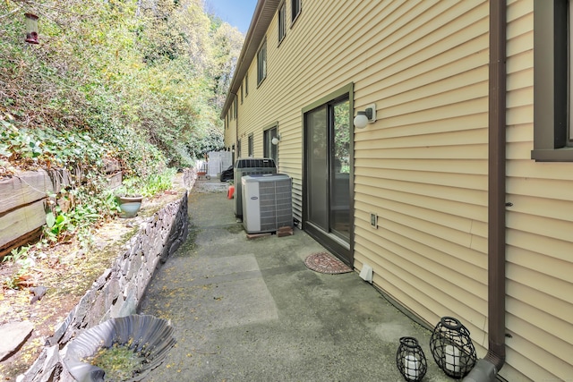 44 Columbus Pl Unit 2, Stamford, CT 06907 - view of home's exterior with central AC unit, a patio area, and fence