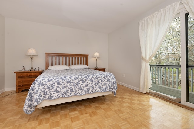 bedroom featuring baseboards and access to exterior