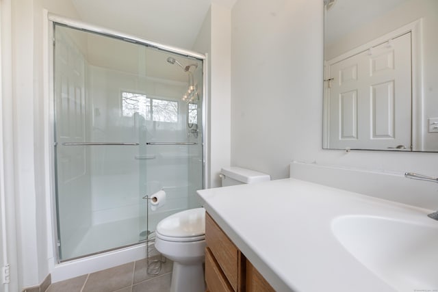 bathroom with toilet, tile patterned floors, a shower stall, and vanity