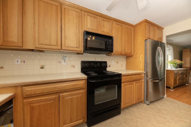 kitchen with light countertops, a ceiling fan, backsplash, and black appliances