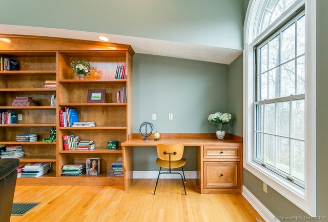 32 Village Dr, East Lyme, CT 06333 - home office featuring light wood-type flooring, healthy amount of natural light, and baseboards