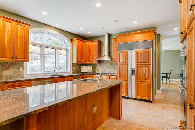 32 Village Dr, East Lyme, CT 06333 - kitchen featuring wall chimney range hood, appliances with stainless steel finishes, a sink, recessed lighting, and backsplash
