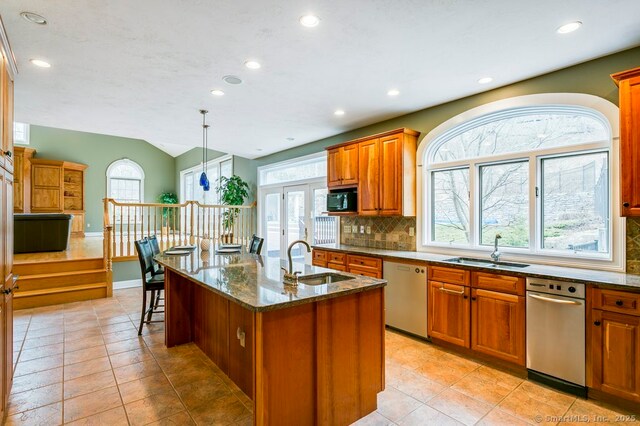 32 Village Dr, East Lyme, CT 06333 - kitchen with a sink, stainless steel dishwasher, black microwave, backsplash, and recessed lighting