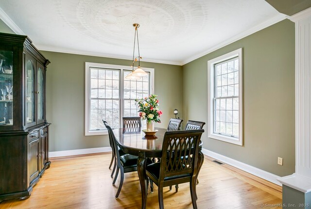 32 Village Dr, East Lyme, CT 06333 - dining room featuring light wood finished floors, healthy amount of natural light, and crown molding