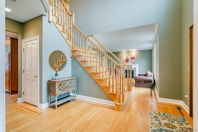 32 Village Dr, East Lyme, CT 06333 - staircase featuring wood finished floors and baseboards
