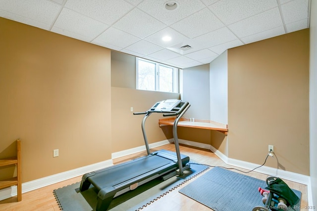 32 Village Dr, East Lyme, CT 06333 - exercise room with baseboards, wood finished floors, and a drop ceiling