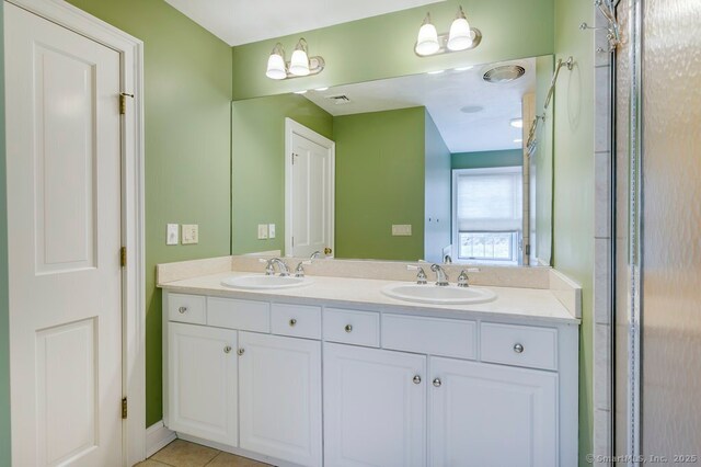 32 Village Dr, East Lyme, CT 06333 - full bathroom featuring double vanity and tile patterned floors