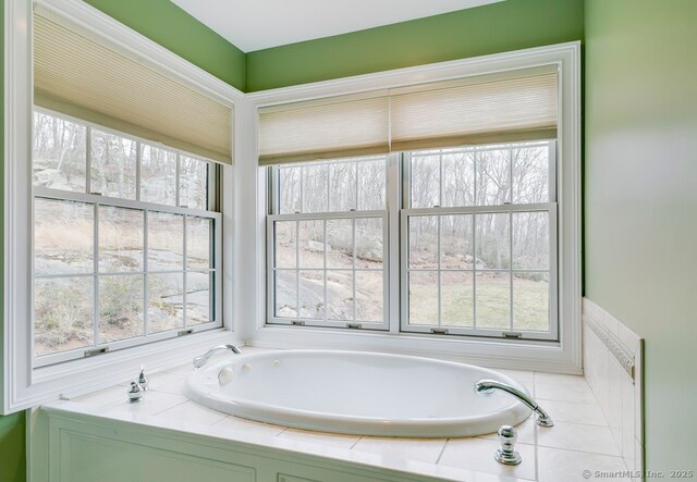 32 Village Dr, East Lyme, CT 06333 - bathroom with a bath and healthy amount of natural light