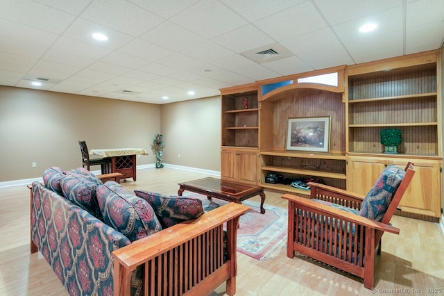 32 Village Dr, East Lyme, CT 06333 - living area with baseboards, light wood-style flooring, and built in features