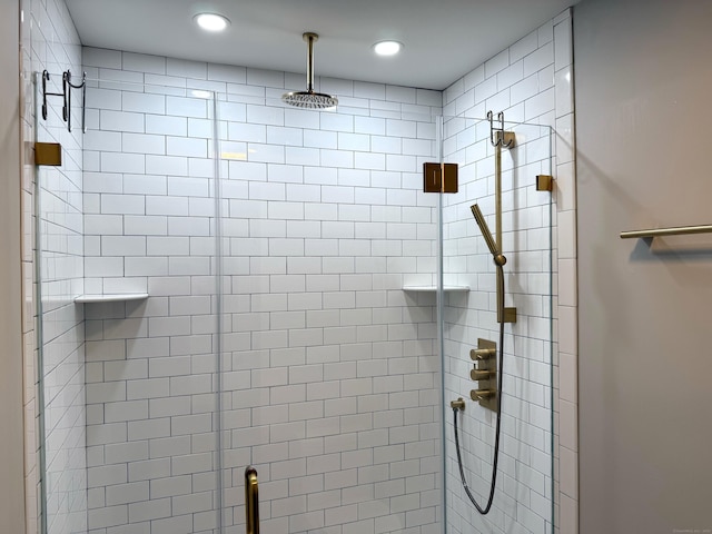 bathroom featuring a shower stall and recessed lighting