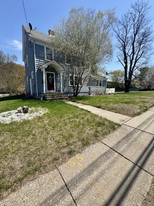 572 Forbes St, East Hartford, CT 06118 - view of front of home featuring a front lawn