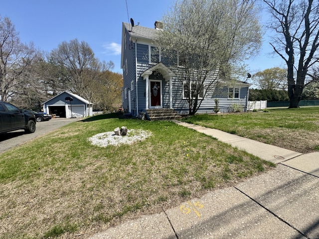 572 Forbes St, East Hartford, CT 06118 - view of front of property with a chimney, a garage, fence, and a front yard