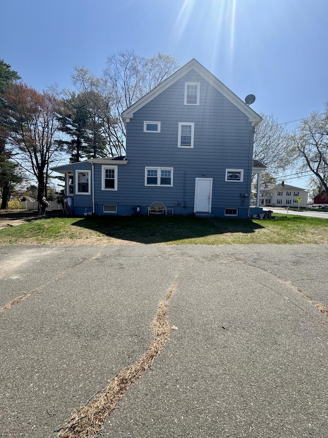 572 Forbes St, East Hartford, CT 06118 - view of home's exterior with a lawn