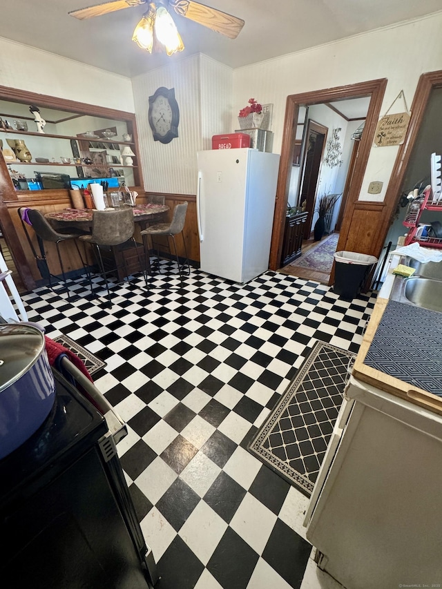 572 Forbes St, East Hartford, CT 06118 - dining room with ceiling fan and tile patterned floors