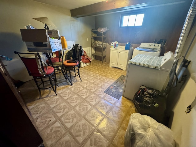 572 Forbes St, East Hartford, CT 06118 - washroom featuring light floors, cabinet space, and washing machine and clothes dryer