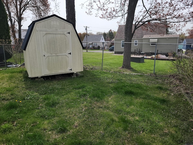 view of shed featuring fence