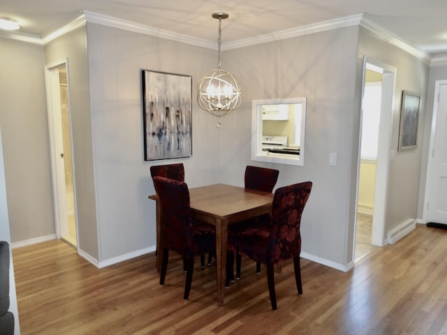 dining room featuring an inviting chandelier, baseboards, wood finished floors, a baseboard radiator, and ornamental molding