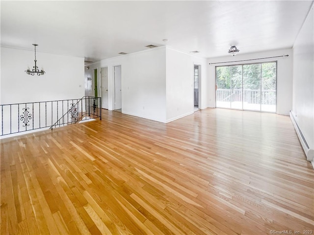 4 Robert Ln, Westport, CT 06880 - unfurnished room with a chandelier, light wood-style flooring, and a baseboard radiator