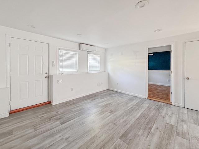 4 Robert Ln, Westport, CT 06880 - foyer entrance with a wall mounted air conditioner and wood finished floors