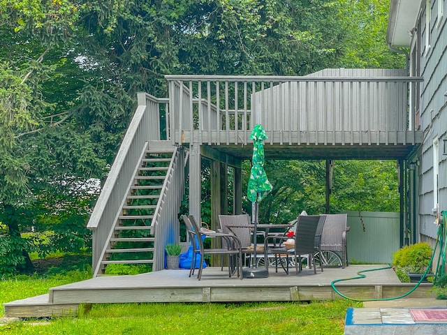 wooden terrace featuring stairs