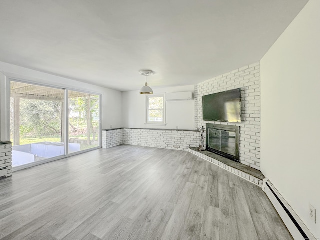 4 Robert Ln, Westport, CT 06880 - unfurnished living room featuring baseboard heating, wood finished floors, a wall unit AC, a fireplace, and wainscoting