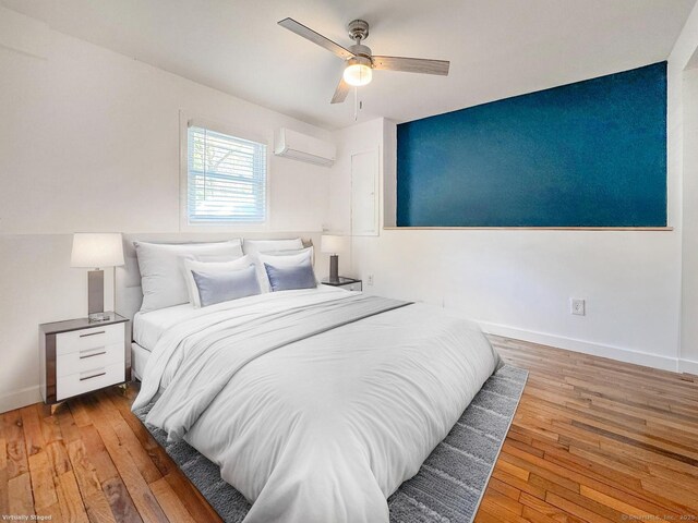 4 Robert Ln, Westport, CT 06880 - bedroom featuring a wall mounted AC, wood-type flooring, and ceiling fan