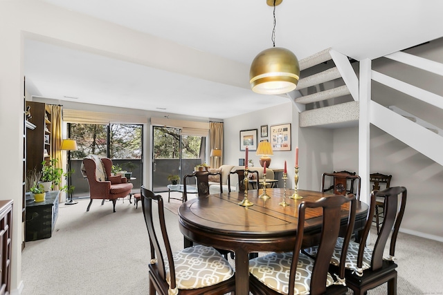 dining room with light carpet