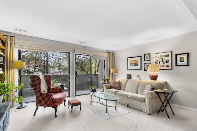 living room with carpet flooring and baseboards